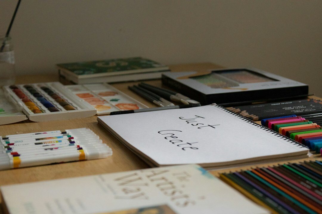 Hand-drawn storyboard sketches spread across a designer's desk